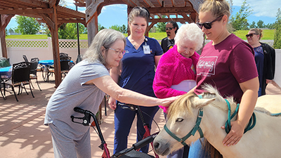 memory care residents enjoy zoo animal visits for cognitive health